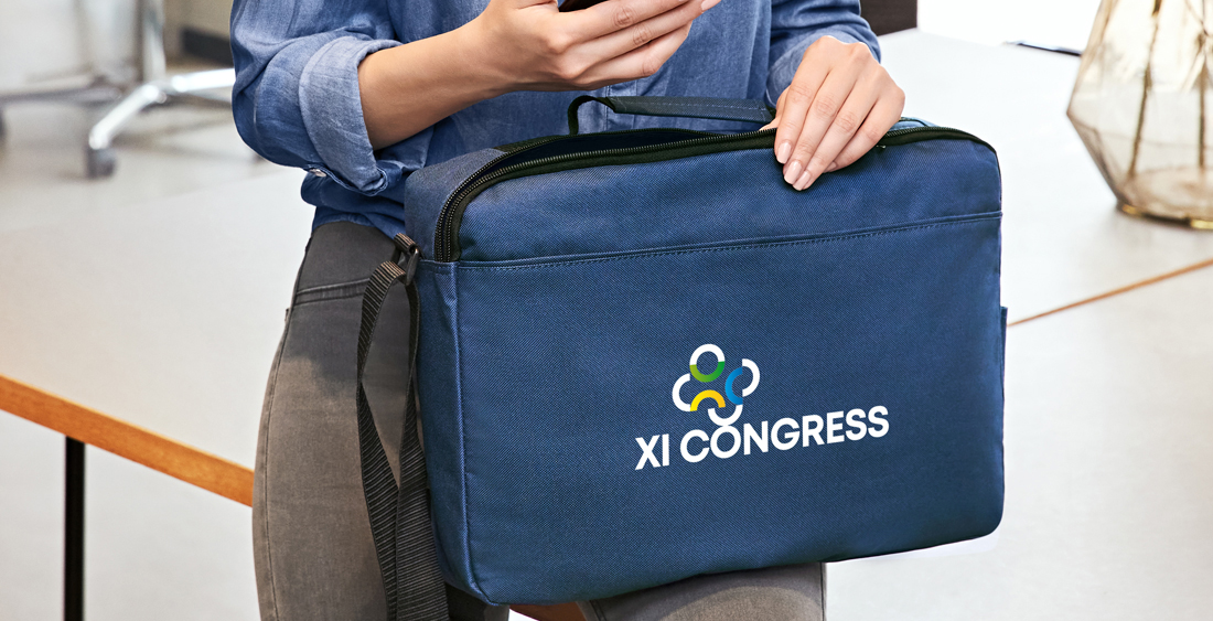 Promotional bags held by office staff