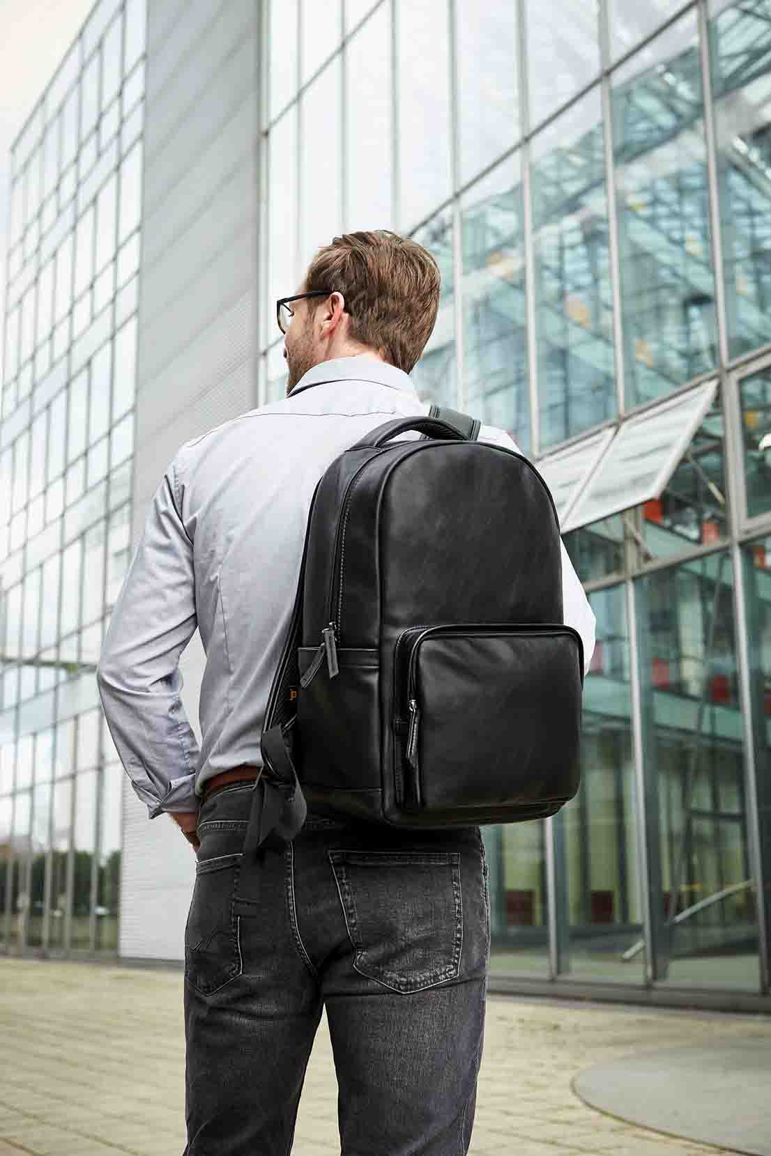 notebook backpack COMMUNITY worn in a business outfit
