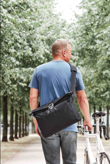 notebook bag LOFT worn outside in a park