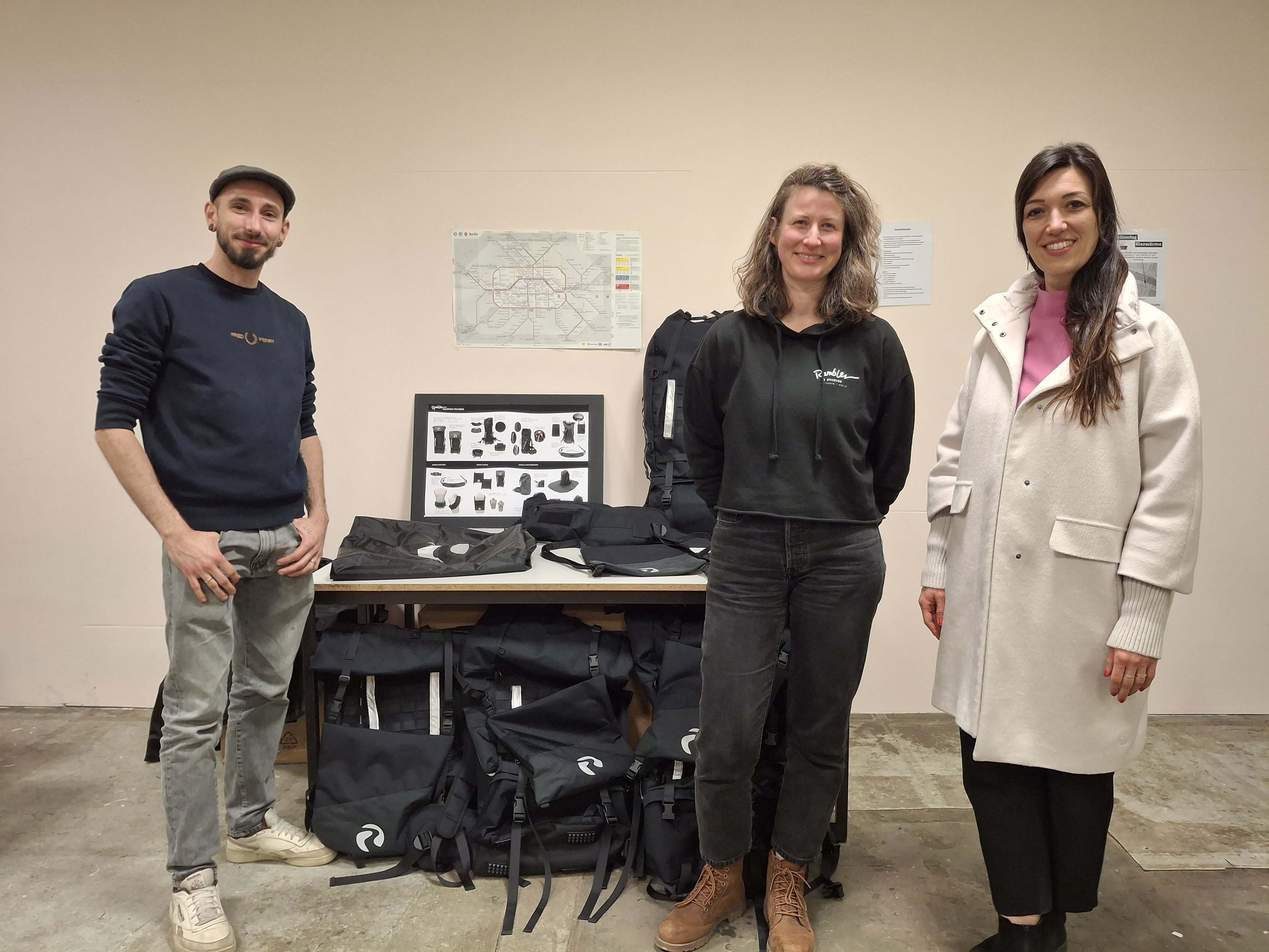 Rambler Backpack, team with multiple outdoor backpacks during distribution